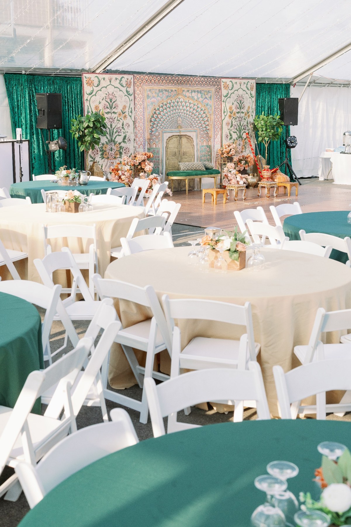 Jago dining tables and seating beside the decorated stage
